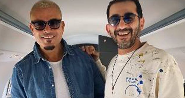 “الألوان جت كده صدفة”.. كواليس لقاء أحمد حلمي وعمرو دياب في الطائرة