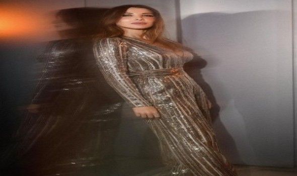 إطلالات عصرية وبسيطة بالجمبسوت على طريقة نانسي عجرم