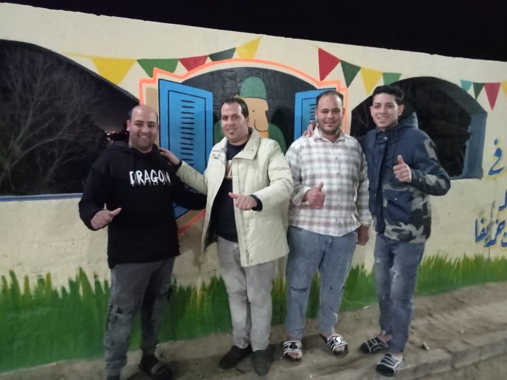 أهالى بهبيت يجملون مدخل قريتهم بجداريات فنية لاستقبال شهر رمضان.. صور