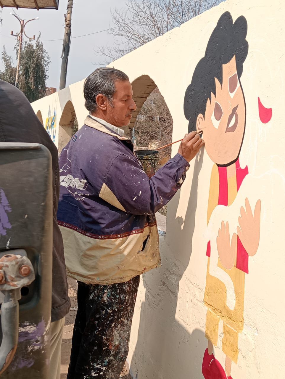 أهالى بهبيت يجملون مدخل قريتهم بجداريات فنية لاستقبال شهر رمضان.. صور