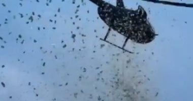 السماء تمطر أموالا.. هليكوبتر تسقط دولارات على "روح" مواطن أمريكى.. فيديو