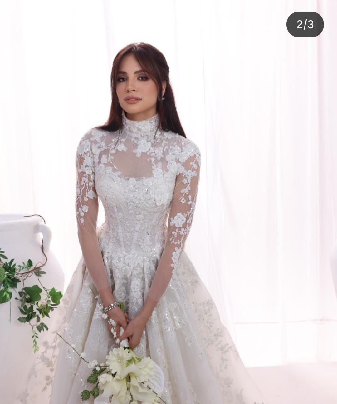 سر ظهور آمال ماهر بفستان زفاف أبيض.. اعرف الحكاية