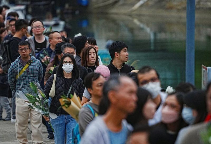 تدفق حشود لتأبين قتلى الحريق بهونغ كونغ وبكين تحذر من أي احتجاجات