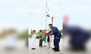 «أبوظبي للدفاع المدني» ترفع العَلم افتخاراً بالإمارات