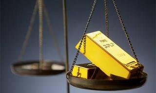 الذهب يتراجع مع ارتفاع أسعار النفط وزيادة التوقعات برفع الفائدة