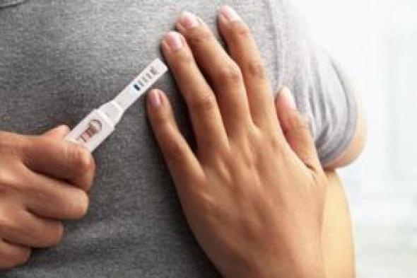اعراض الحمل تشمل الصداع وضيق تنفس