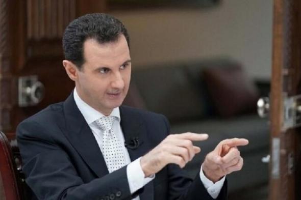 تراند اليوم : ما سر زجاجة ظهرت خلف الأسد بحسب السوريين؟ خيال أم حقيقة؟ (صور + فيديو)